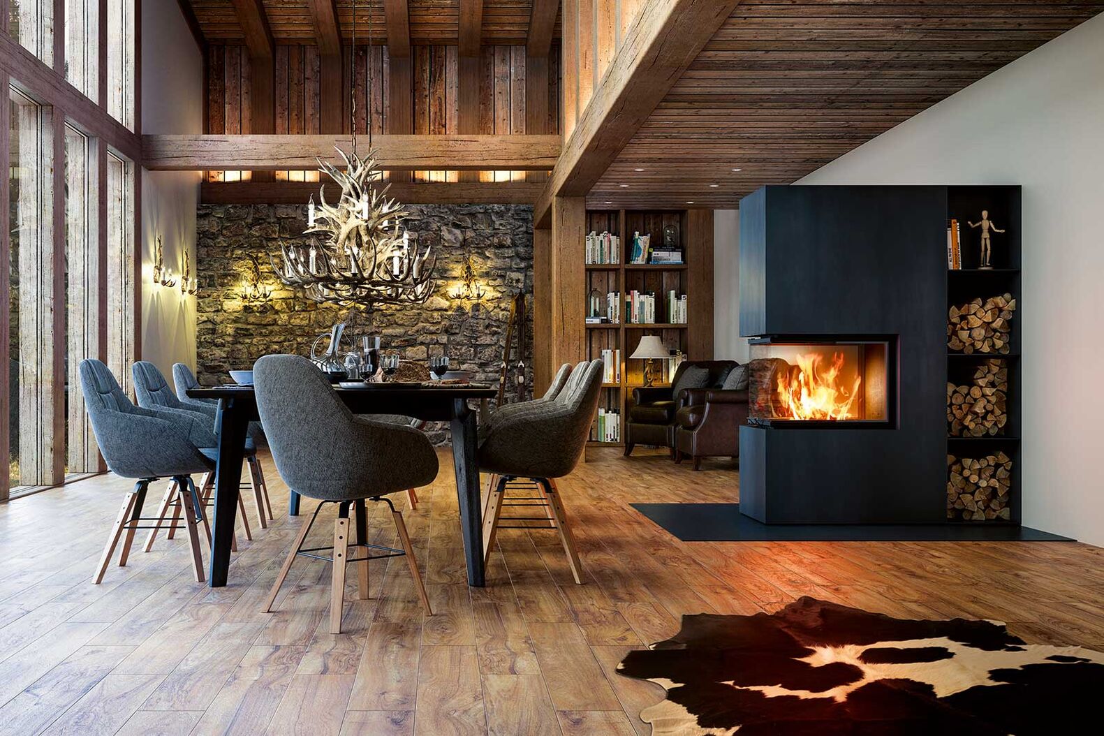 Ein dreiseitiges Cheminée, wie dieses von Ganz Baukeramik, bietet eine dezentere Möglichkeit, um Räume zu strukturieren. Das Feuer lässt sich von drei Seiten geniessen, ohne dass es zu prominent wirkt. Ganz Baukeramik AG, www.ganz-baukeramik.ch